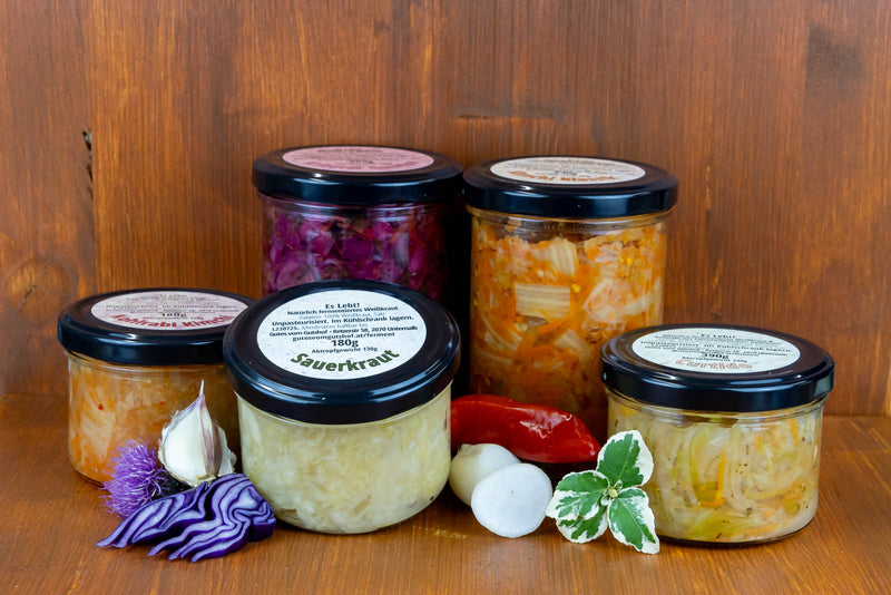 a selection of fermented vegetables in jars